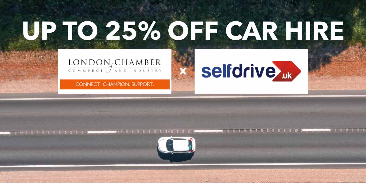 Aerial view of a white car driving on a highway. Text above reads "Up to 25% off car hire" with logos of London Chamber and Selfdrive UK.