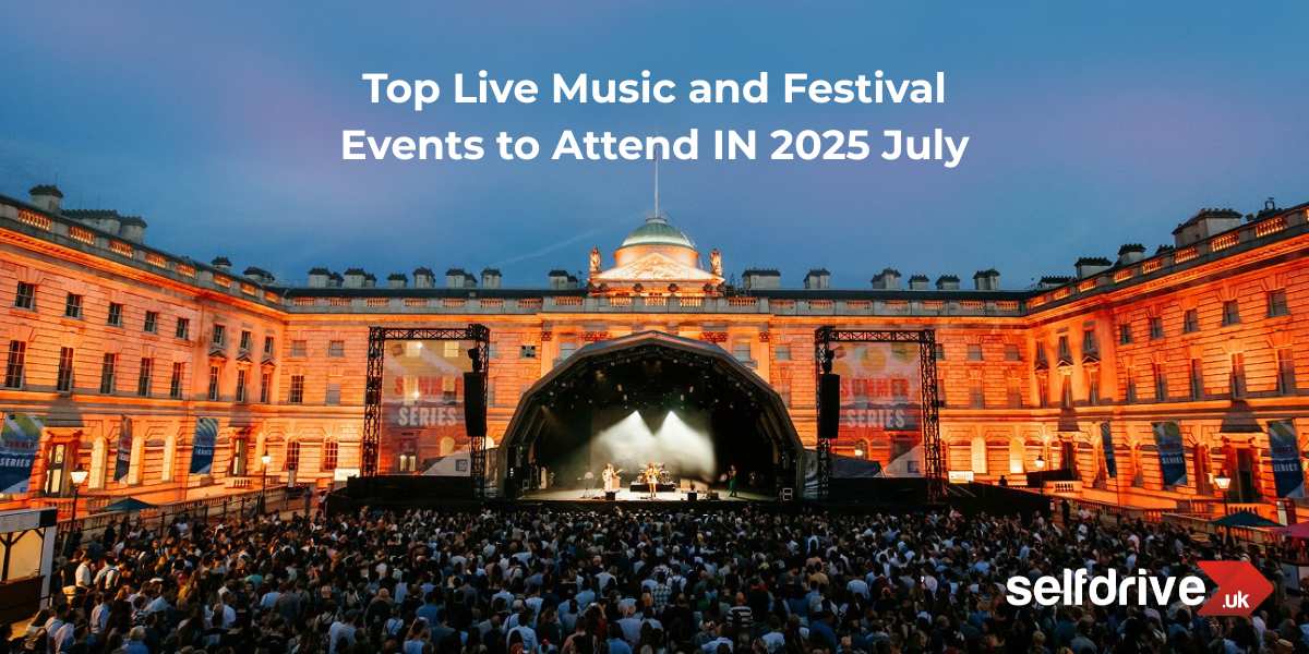 Outdoor concert at an illuminated historic building with a large crowd, stage, and banners.