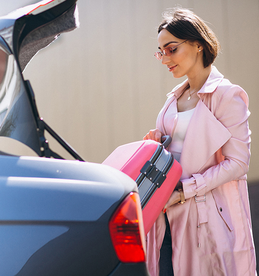 A right close up of a yellow Mercedes AMG sports car headlight on a city street